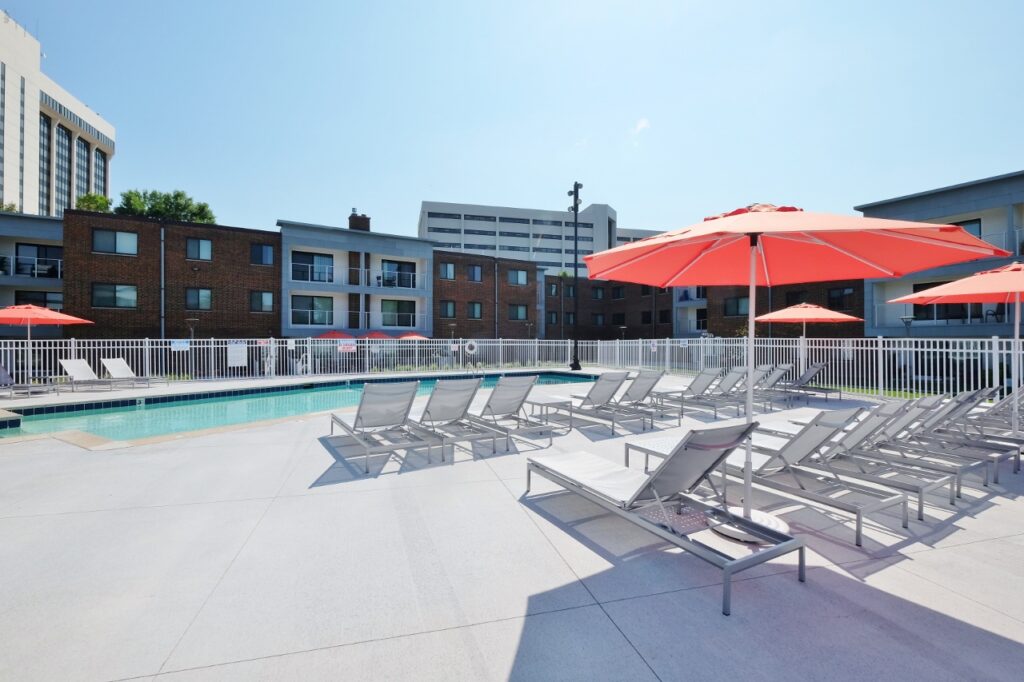 Lounge seating surrounding Shelard Village's community pool